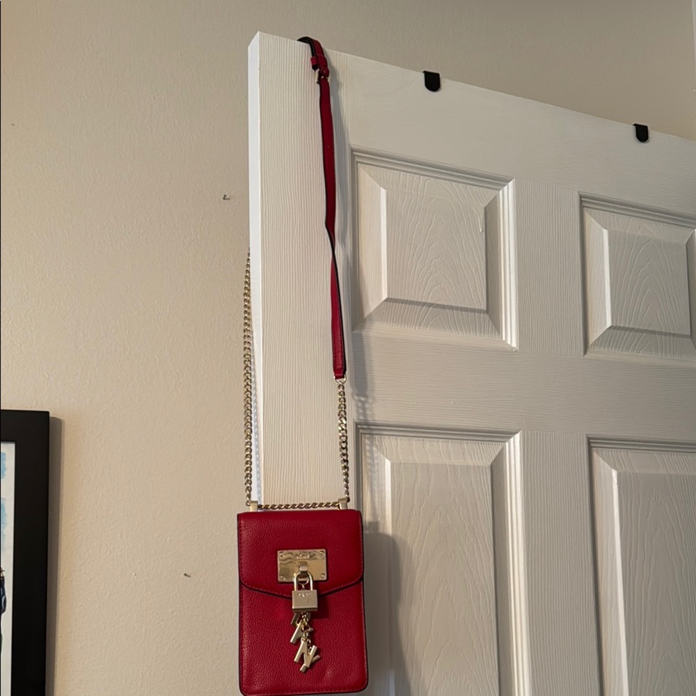 DKYN purse with a strap approximately 20 in long. Never used. New without tags.
